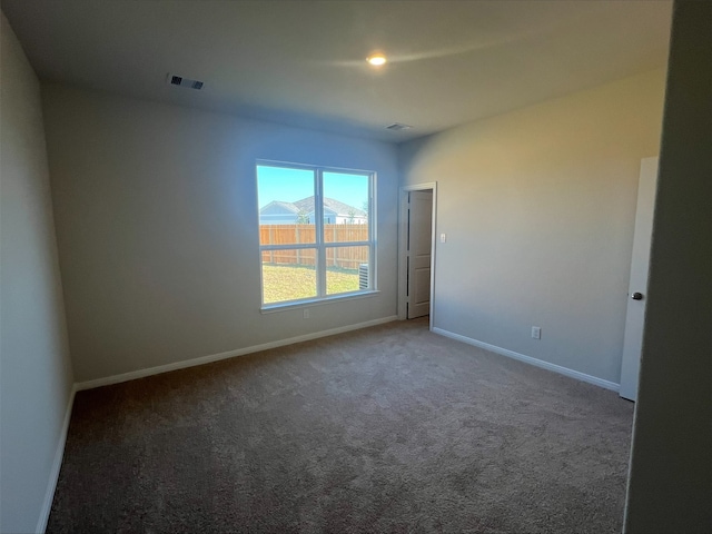 15850 Berry Hill Dr, Conroe, TX 77303 - spare room with carpet and baseboards