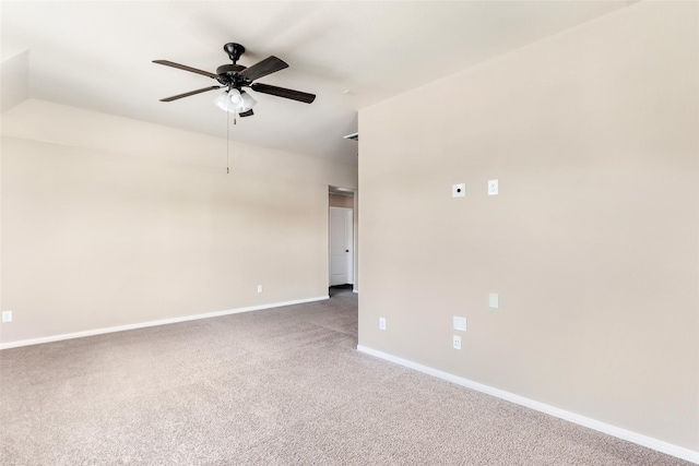 empty room featuring baseboards, ceiling fan, and carpet floors
