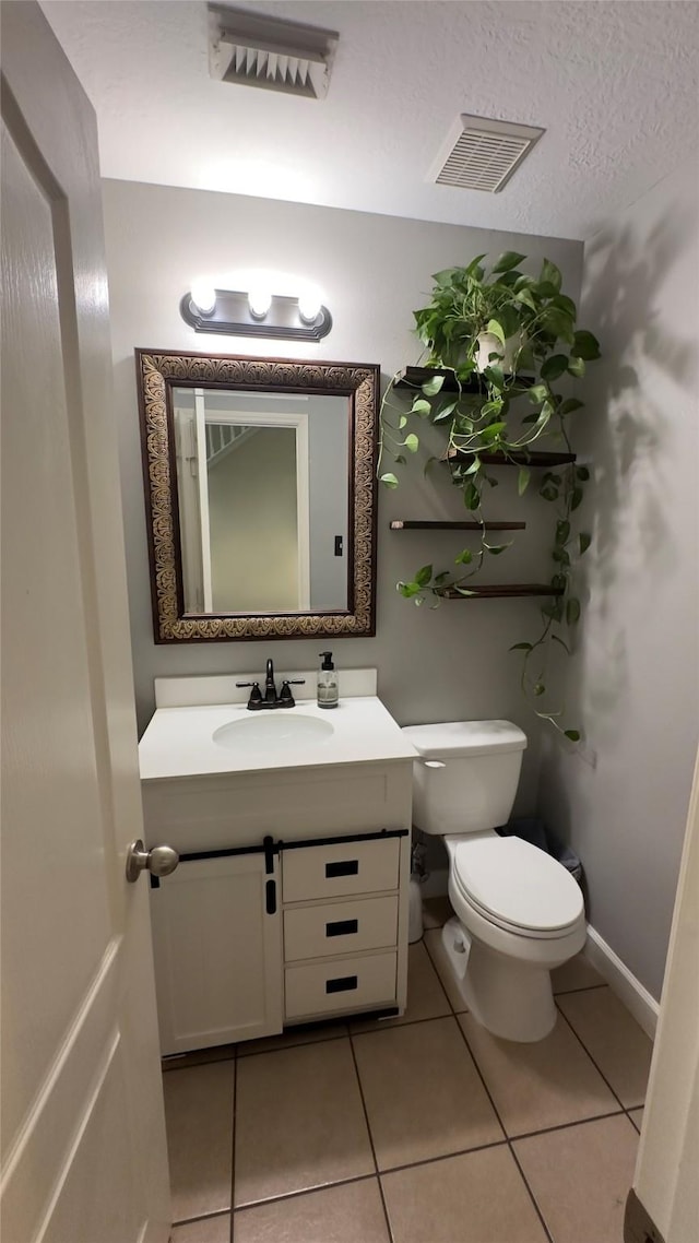 6514 Evening Rose Ln, Katy, TX 77449 - half bathroom with toilet, vanity, and tile patterned floors
