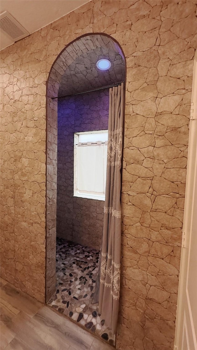 6514 Evening Rose Ln, Katy, TX 77449 - corridor with wood finished floors and arched walkways