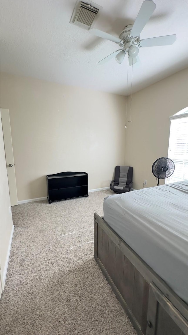 6514 Evening Rose Ln, Katy, TX 77449 - carpeted bedroom with baseboards and a ceiling fan