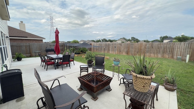 6514 Evening Rose Ln, Katy, TX 77449 - view of patio / terrace featuring a fire pit, outdoor dining space, and area for grilling