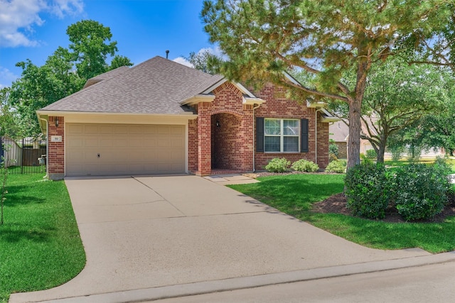 traditional home featuring an attached garage, brick siding, concrete driveway, and a shingled roof