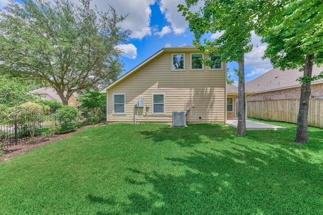 rear view of property with a patio area and central air condition unit
