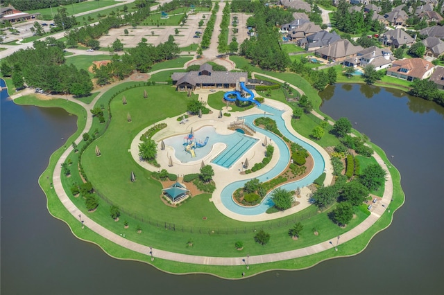 aerial overview of property's location featuring a nearby body of water and a pool area