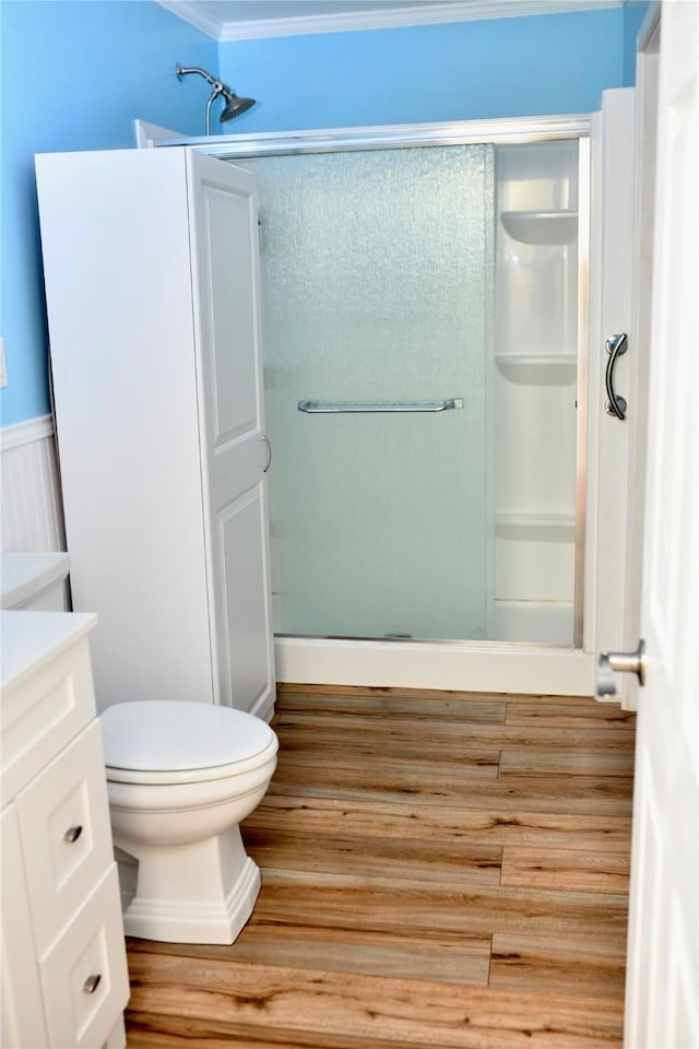 112 Lcr 902, Jewett, TX 75846 - bathroom with a shower stall, wood finished floors, toilet, vanity, and crown molding