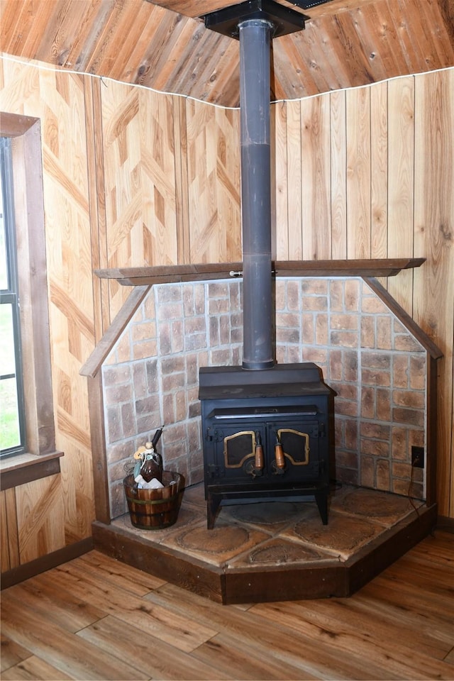 112 Lcr 902, Jewett, TX 75846 - detailed view of a wood stove, wood finished floors, wood walls, and baseboards
