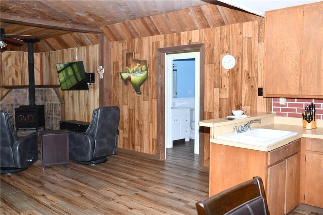 112 Lcr 902, Jewett, TX 75846 - kitchen with a sink, wood walls, light countertops, open floor plan, and wooden ceiling