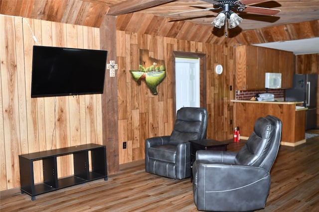 112 Lcr 902, Jewett, TX 75846 - living room with wood walls, wood finished floors, ceiling fan, and beamed ceiling