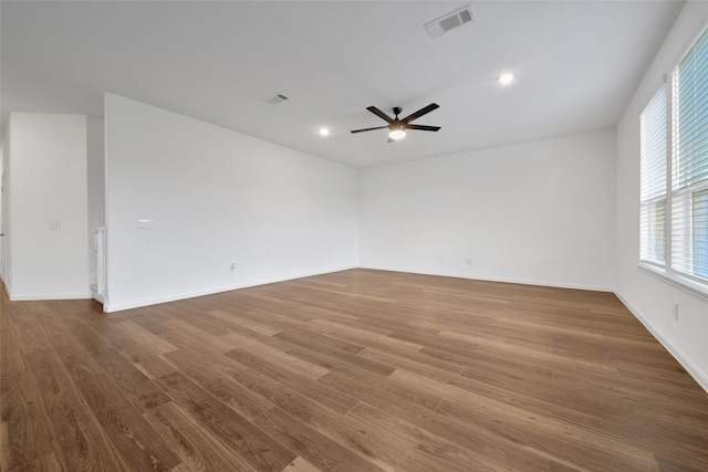 23431 Wrexham St, Spring, TX 77373 - unfurnished room with dark wood-style floors, a ceiling fan, baseboards, and recessed lighting