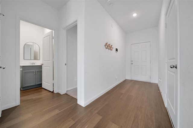 23431 Wrexham St, Spring, TX 77373 - hall featuring dark wood-style flooring, baseboards, and a sink