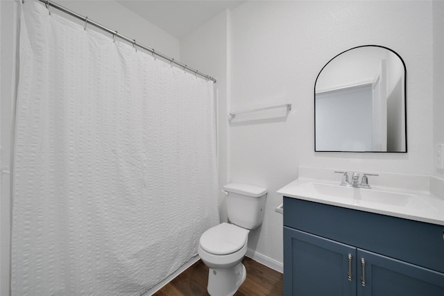 23431 Wrexham St, Spring, TX 77373 - bathroom with wood finished floors, baseboards, vanity, and toilet