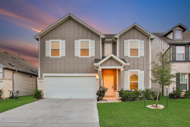 23431 Wrexham St, Spring, TX 77373 - view of front of house featuring board and batten siding, concrete driveway, a garage, a front lawn, and stone siding