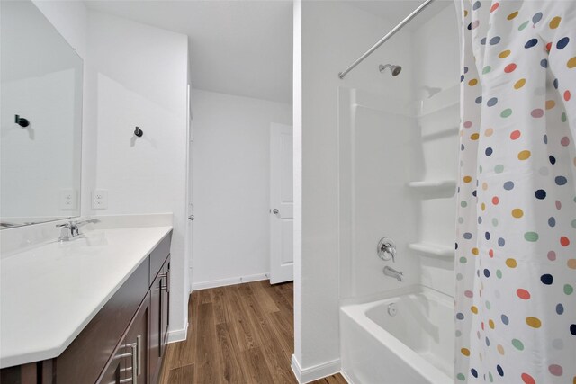 23431 Wrexham St, Spring, TX 77373 - full bath with wood finished floors, vanity, baseboards, and shower / bath combo
