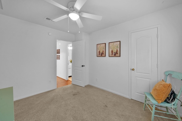 unfurnished bedroom with light carpet, ceiling fan, and baseboards