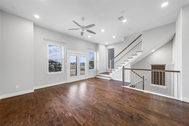 unfurnished living room featuring ceiling fan, wood finished floors, recessed lighting, baseboards, and stairway