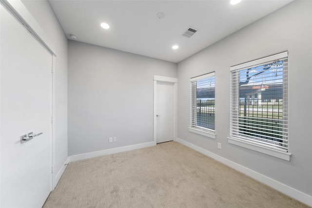 unfurnished bedroom with baseboards, carpet, and recessed lighting