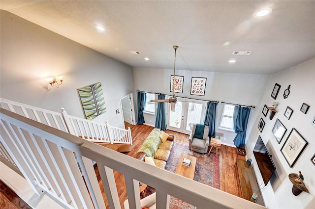 living room with wood finished floors, recessed lighting, and baseboards