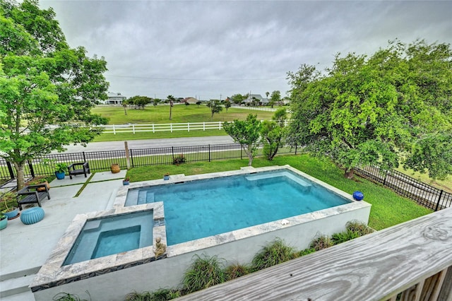 view of swimming pool featuring a patio and an in-ground hot tub