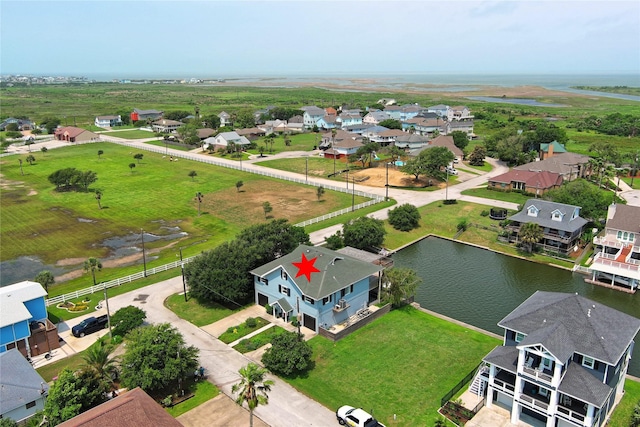aerial perspective of suburban area with a large body of water