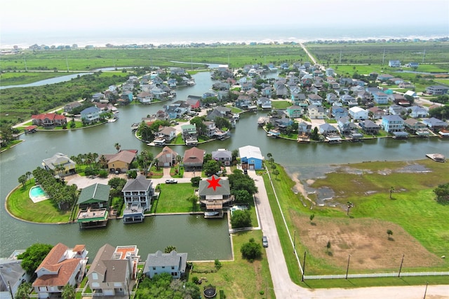 aerial view of residential area with a large body of water