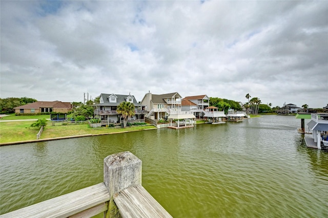 dock featuring a water view and a residential view