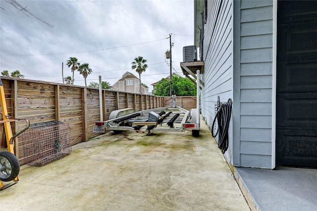 view of parking / parking lot featuring a fenced backyard