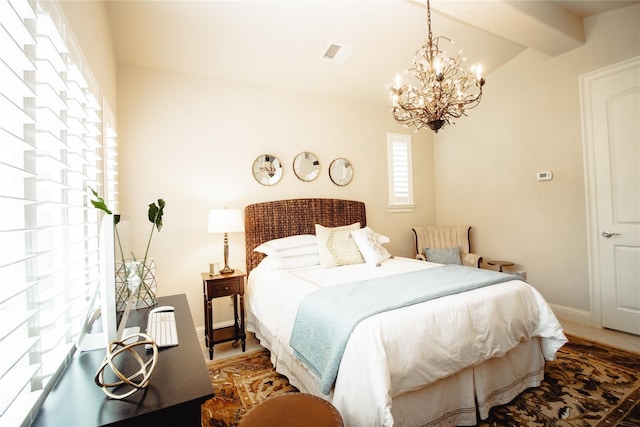 bedroom featuring a chandelier, beam ceiling, baseboards, and wood finished floors