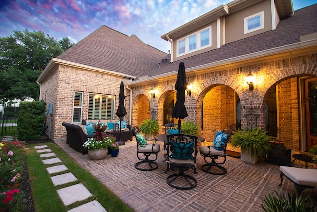 view of patio featuring outdoor lounge area and fence