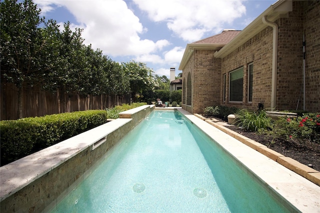 view of pool with fence