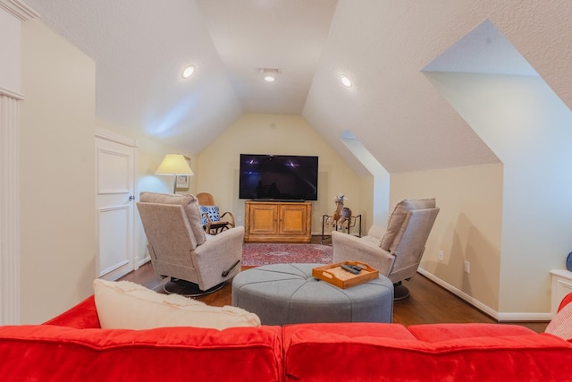 34 S Taylor Point Dr, The Woodlands, TX 77382 - home theater room with vaulted ceiling, wood finished floors, baseboards, and recessed lighting