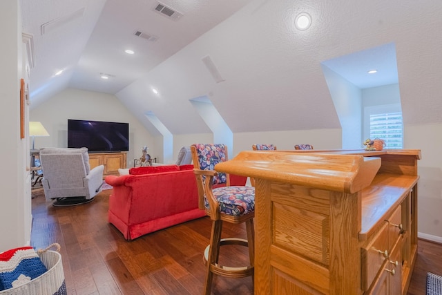 34 S Taylor Point Dr, The Woodlands, TX 77382 - cinema room with dark wood finished floors, vaulted ceiling, and a bar