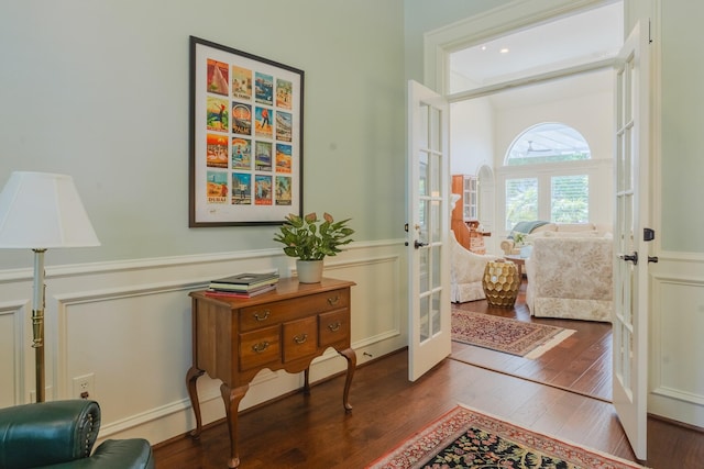 34 S Taylor Point Dr, The Woodlands, TX 77382 - entrance foyer featuring french doors, wood finished floors, and a wainscoted wall