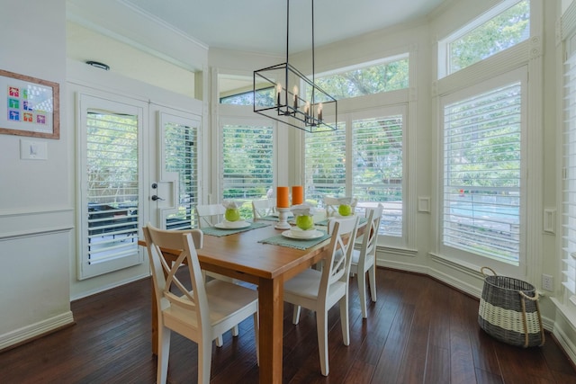 34 S Taylor Point Dr, The Woodlands, TX 77382 - dining room featuring a chandelier, dark wood-style flooring, plenty of natural light, and ornamental molding