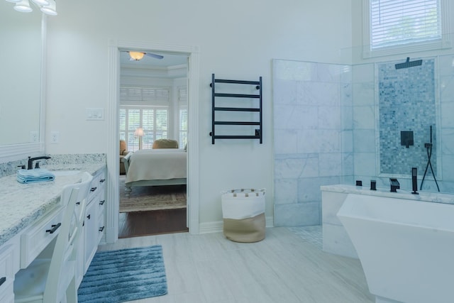 34 S Taylor Point Dr, The Woodlands, TX 77382 - ensuite bathroom featuring vanity, walk in shower, a ceiling fan, a towel warming rack, and a freestanding bath