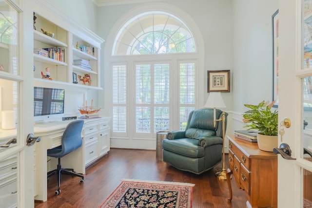 34 S Taylor Point Dr, The Woodlands, TX 77382 - home office with built in study area, dark wood-style floors, plenty of natural light, and ornamental molding