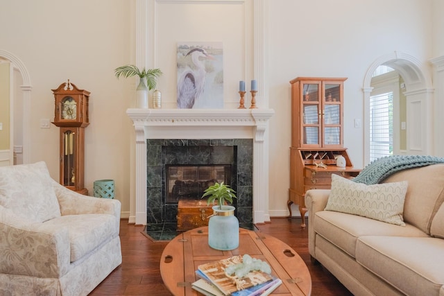 34 S Taylor Point Dr, The Woodlands, TX 77382 - living area featuring dark wood finished floors and a fireplace