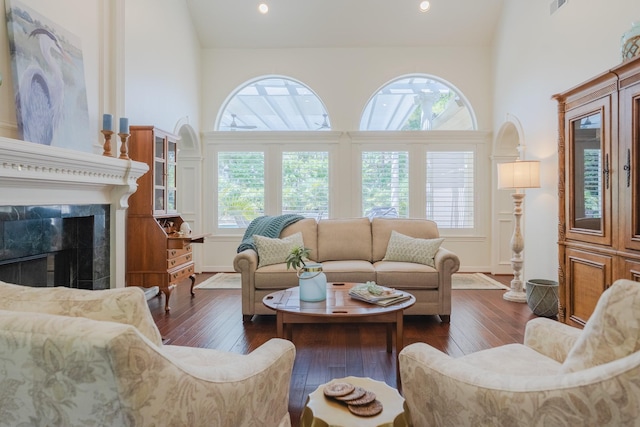 34 S Taylor Point Dr, The Woodlands, TX 77382 - living area featuring a high ceiling, dark wood-style floors, a fireplace, and recessed lighting