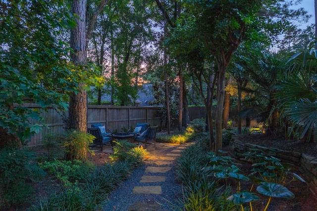 34 S Taylor Point Dr, The Woodlands, TX 77382 - view of yard with an outdoor fire pit and a patio
