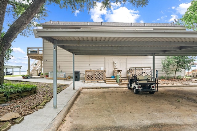 79 Lakeview Vlg, Conroe, TX 77356 - view of vehicle parking with stairway and a carport