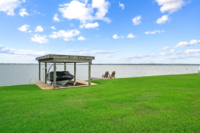79 Lakeview Vlg, Conroe, TX 77356 - dock featuring boat lift, a lawn, and a water view