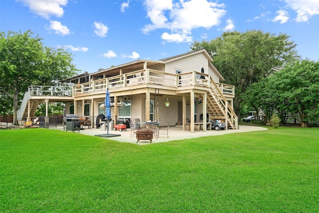 79 Lakeview Vlg, Conroe, TX 77356 - rear view of property with stairway, an outdoor fire pit, and a wooden deck
