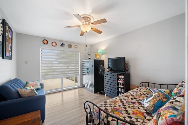 79 Lakeview Vlg, Conroe, TX 77356 - bedroom with light wood-style flooring, access to outside, and a ceiling fan