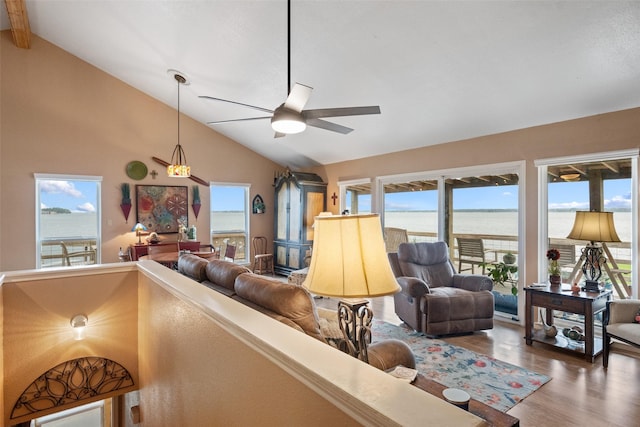 79 Lakeview Vlg, Conroe, TX 77356 - living area with wood finished floors, a ceiling fan, plenty of natural light, a water view, and beam ceiling