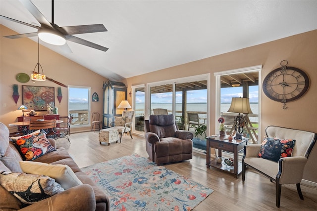 79 Lakeview Vlg, Conroe, TX 77356 - living area featuring vaulted ceiling, wood finished floors, and ceiling fan