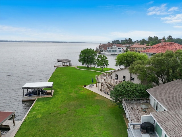 79 Lakeview Vlg, Conroe, TX 77356 - dock area with a water view and a lawn