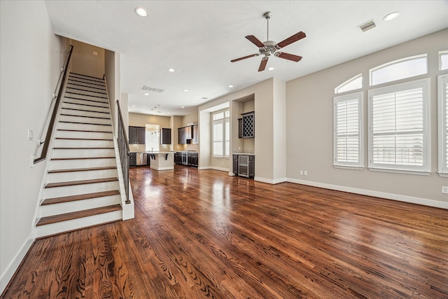 4209 Feagan St, Houston, TX 77007 - unfurnished living room with dark wood-style flooring, a ceiling fan, stairs, baseboards, and recessed lighting