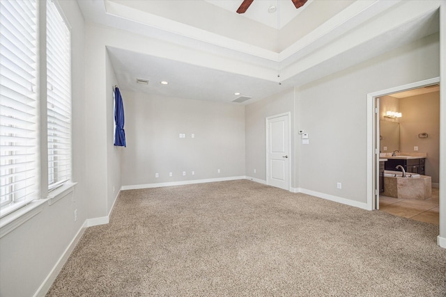 4209 Feagan St, Houston, TX 77007 - spare room with carpet flooring, a ceiling fan, baseboards, and a sink