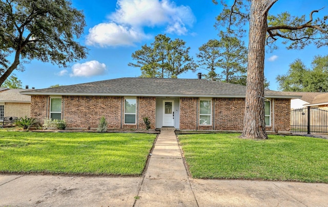 12318 Amado Dr, Houston, TX 77065 - view of front of home featuring brick siding and roof with shingles