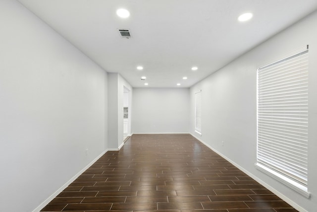 12318 Amado Dr, Houston, TX 77065 - hallway featuring recessed lighting, dark wood finished floors, and baseboards